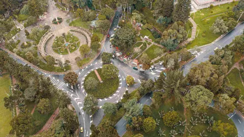 An aerial view of the general layout of the National Park, showing several grassy semicircles, roads, and abundant trees and vegetation.