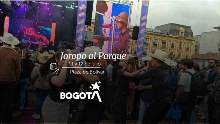 Couples dancing joropo in traditional costumes and hats at Bolívar Square.
