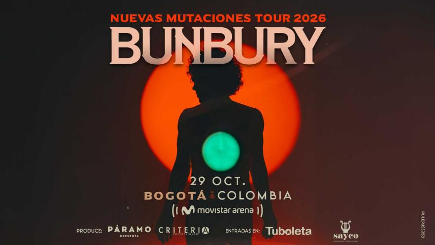 Silueta oscura de Bunbury a contraluz de un círculo rojo gigante y un destello verde en el pecho.