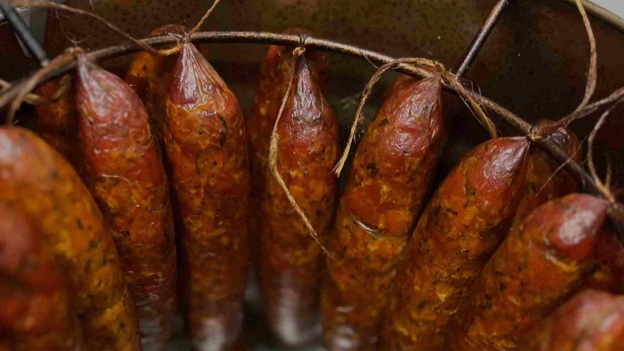 Richly colored and textured artisanal cold cuts, presented traditionally and ready to enjoy.