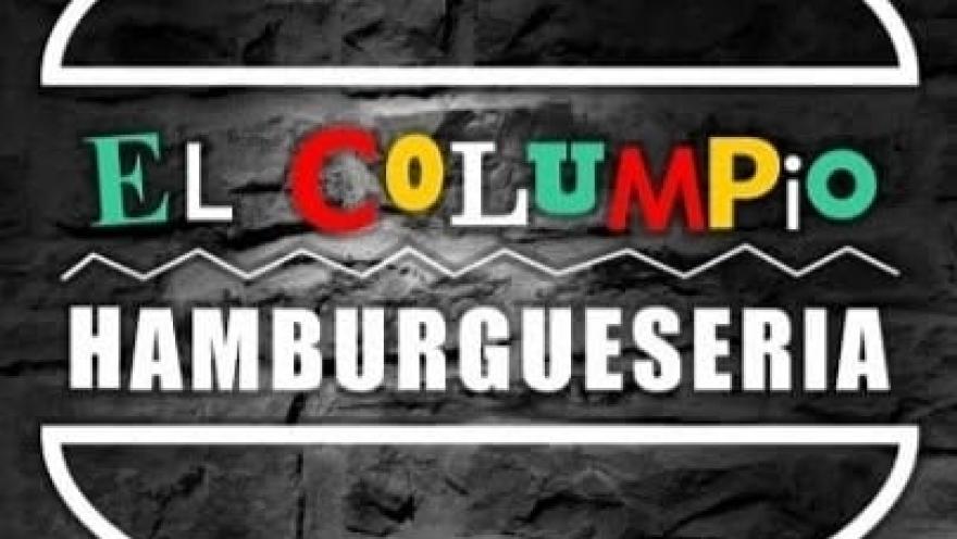  Logo de El Columpio Hamburguesería sobre fondo de ladrillo.